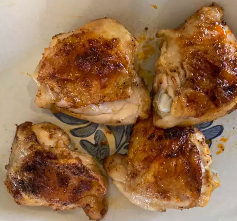 Juicy air fryer chicken breast on a plate, showcasing a healthy and quick meal option.